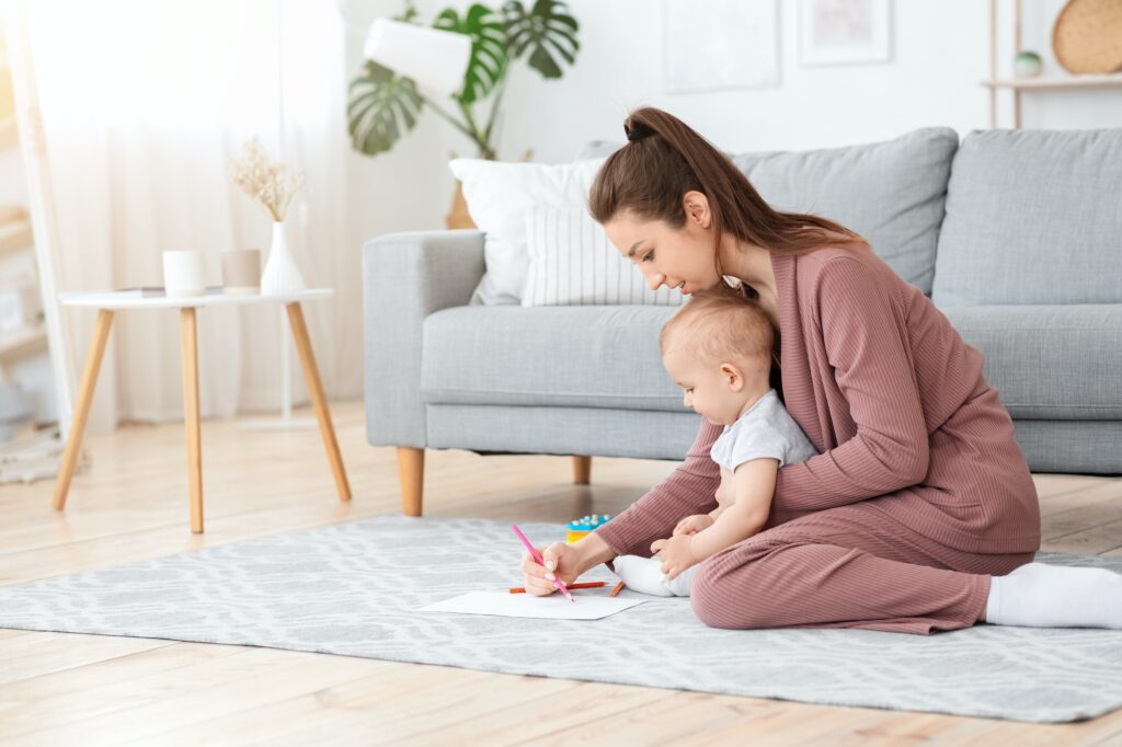 Early Development For Babies. Mother Drawing With Her Little Son At Home