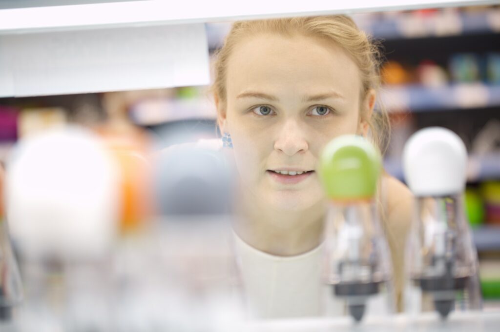 Young woman analyzing products in a store